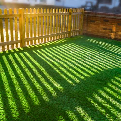 Finished artificial lawn in a small enclosed garden